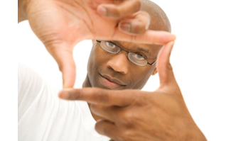 Man making fingers into box